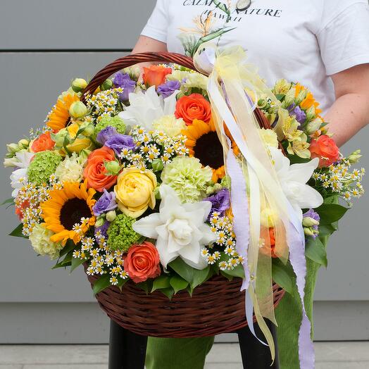 Basket of summer flowers lilies, sunflowers, daisies summer is love