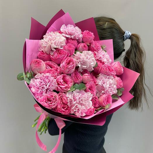 Bright bouquet of pionoid bush roses and delicate diatus