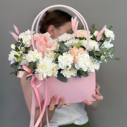 Composition of fresh flowers in a purse