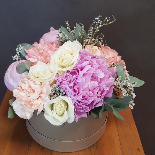 Flowers in the box. Fragrant peonies with diantus