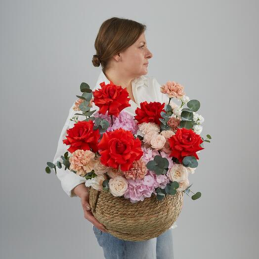 The composition in a basket of French roses, hydrangeas and pionoid roses. Bouquet 650